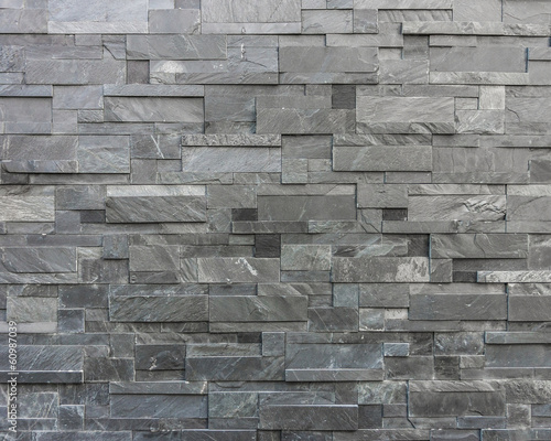 Board z aluminiowym obramowaniem Nowoczesny kamienny mur zbudowany z kamiennych płyt
