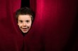 © Deyan Georgiev - Child appearing beneath the curtain