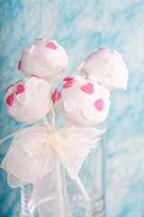 Wedding cake pops in white and soft blue.