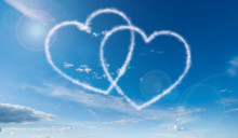 Heart Shaped Clouds On Blue Sky Background