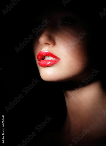 Photographie  Woman with Red Lips in Shadows. Spotlight