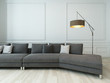 Gray couch and floor lamp against white wall