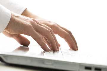 Wall Mural - Man typing on a laptop computer