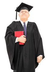 Wall Mural - Proud male college professor holding books and standing