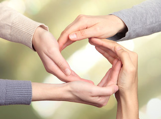 Wall Mural - Human hands making circle on bright background