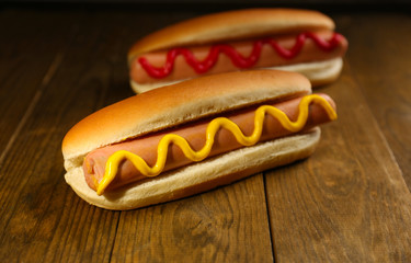 Poster - Tasty hot dogs on wooden table