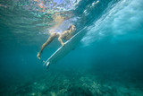 Fototapeta Łazienka - surfing a wave.underwater viewing.