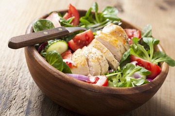 Wall Mural - chicken salad with tomatoes and cucumber