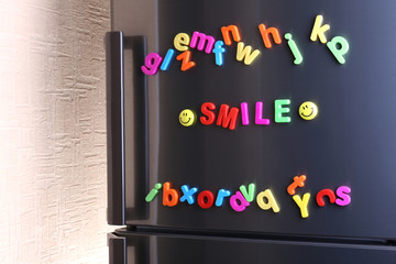 Wall Mural - Word Smile spelled out using colorful magnetic letters