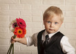 © natalinka29 - Young blond man in with bouquet flowers.