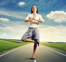 Wall Mural - businesswoman standing in meditation asana