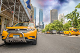 Fototapeta  - New York City. Yellow Cabs on West 59st - Central Park area
