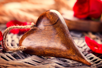 Poster - Valentine's Day. Wooden heart over wood background