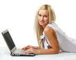 © lenets_tan - Portrait of a businesswoman lying on the floor with laptop.