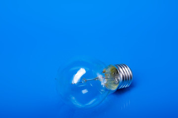 A light bulb, isolated on blue background.