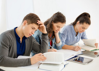 Wall Mural - students with notebooks and tablet pc at school