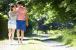 © Monkey Business - Romantic Asian Couple On Walk In Countryside