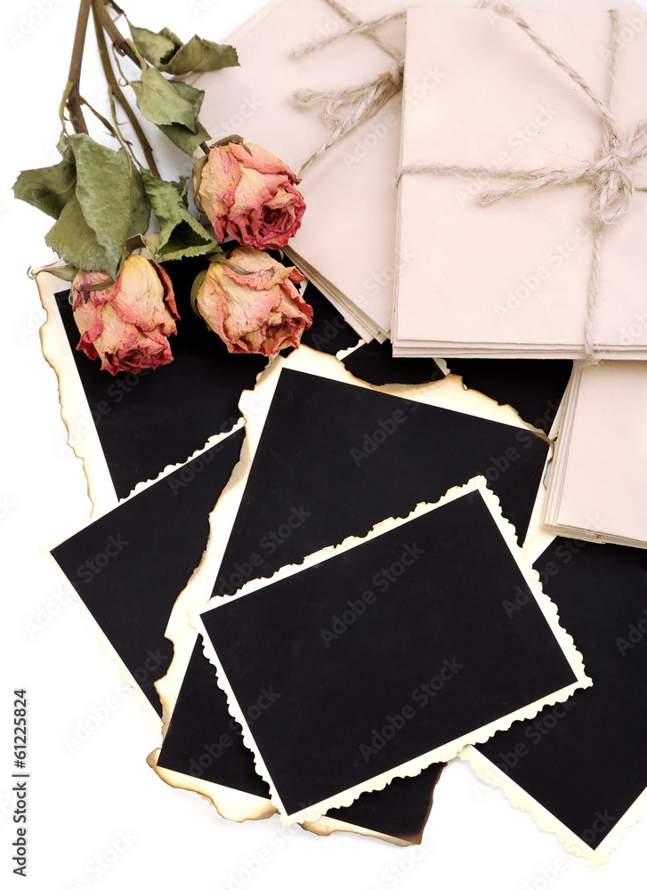 Blank old photos, letters and dried flower, isolated on white