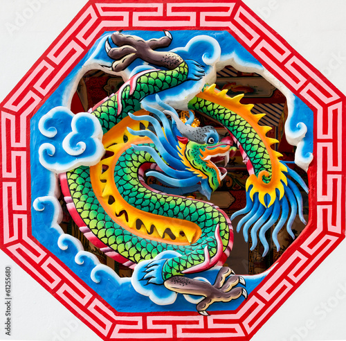 Fototapeta na wymiar Chinese dragon in octagon window