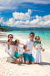© travnikovstudio - Young happy family and two kids with word LOVE on tropical