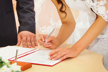 Bride Signing Marriage License Or Wedding Contract
