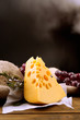 Piece of cheese with grape and rosemary