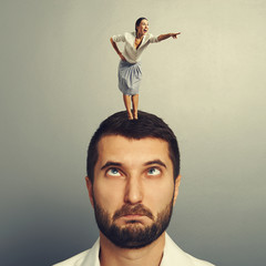 Canvas Print - woman standing on the head and pointing