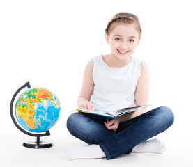 Portrait of a cute little girl with a globe.