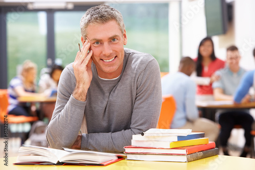 Fotografia Male Mature Student Studying In Classroom With Books