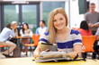 © micromonkey - Female Teenage Student In Classroom With Digital Tablet