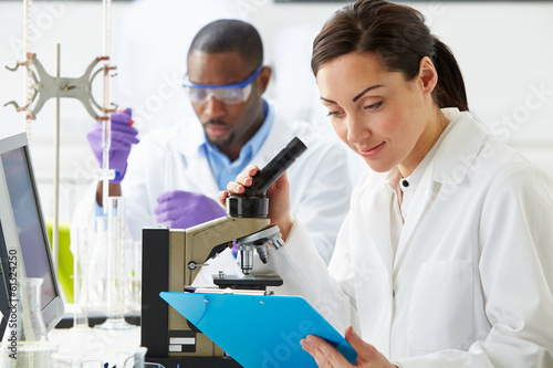 Fotografija Technicians Carrying Out Research In Laboratory