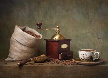 Still Life With Cup Of Coffee And Grinder