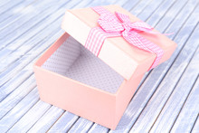 Open Gift Box On Wooden Background