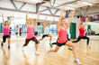 © Syda Productions - group of smiling people stretching in the gym