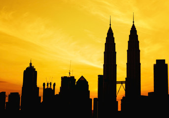 Wall Mural - Silhouette of KLCC tower during golden sunrise