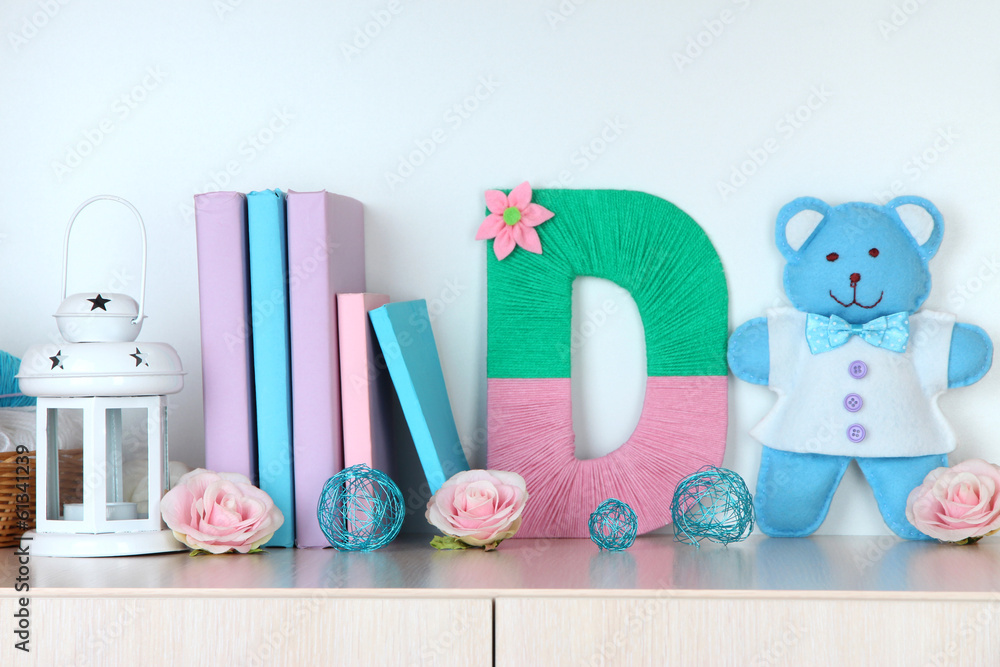 Shelf decorated with handmade knit letter