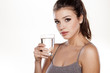 © vladimirfloyd - beautiful young woman posing with a glass of water in her hand
