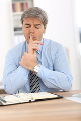 Wall Mural - Businessman with thoughtful expression on his face