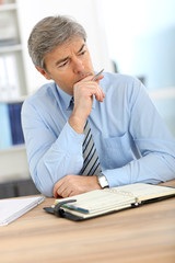 Wall Mural - Businessman with worried expression on his face