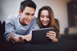 © Jacob Lund - Teenage couple using digital tablet - Indoors