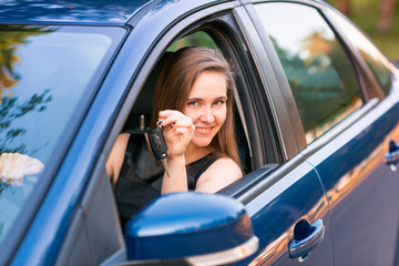 Wall Mural - Beautiful businesswoman sitting in the car