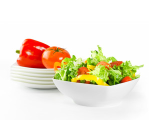 Wall Mural - Fresh salad and vegetables in white plates with clipping path