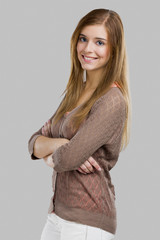 Poster - Beautiful blonde woman standing over a white background