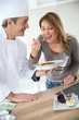 © goodluz - Chef preparing pasta dish for woman