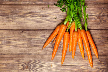 Wall Mural - Carrot on a wooden table