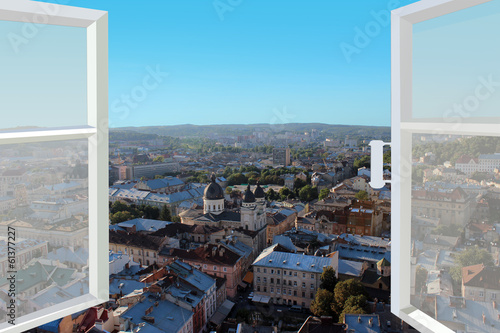 Plakat na papierze fotorealistycznym Otworzyło okno na dachy miasta