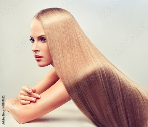 Naklejka nad blat kuchenny Beautiful blonde woman with long, healthy and shiny hair.