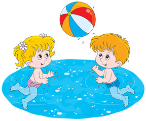 Little girl and boy playing with a big colorful ball