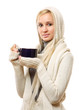 © lenets_tan - A young woman with a hood on head is drinking