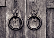 Ancient Wooden Gate With Door Knocker Rings